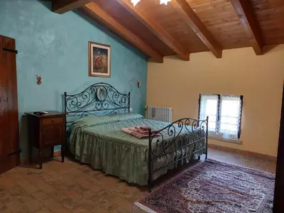Letto o letti in una camera di Corte Ventaglio
