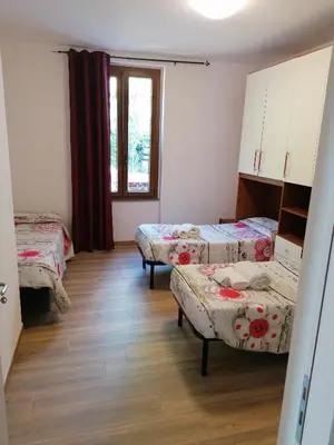 Letto o letti in una camera di Le camelie