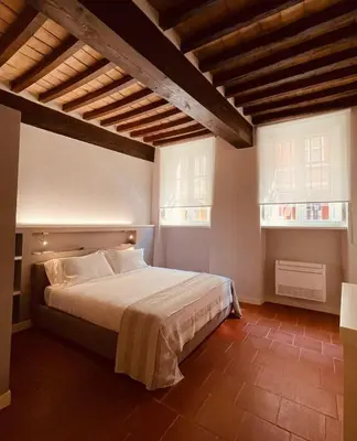 Letto o letti in una camera di Palazzo Borgocolonne Apartments - Manu Maison