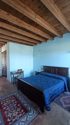 Letto o letti in una camera di B&B Santa Cristina
