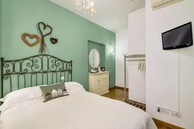 Letto o letti in una camera di Affittacamere La Collina Degli Ulivi