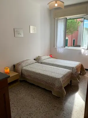 Letto o letti in una camera di Casa Bianca 2 - confortevole in centro a Moneglia