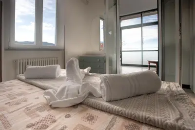 Letto o letti in una camera di 162 - La Veranda Sull'Acqua, Fronte e Vista Mare Riva Trigoso, POSTO AUTO PRIVATO