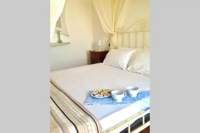 Letto o letti in una camera di splendido appartamento vista mare