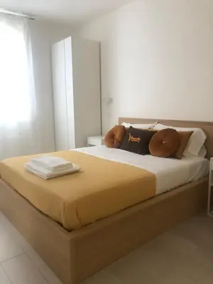 Letto o letti in una camera di NANNARE' APPARTAMENT