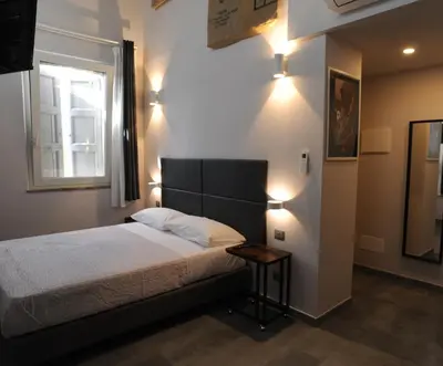 Letto o letti in una camera di TLcafè Hospitality