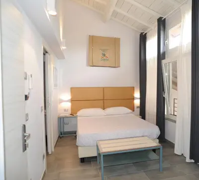 Letto o letti in una camera di TLcafè Hospitality