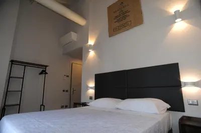 Letto o letti in una camera di TLcafè Hospitality