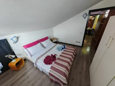Letto o letti in una camera di Piccolo paradiso