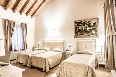 Letto o letti in una camera di Hotel Villa Borghesi