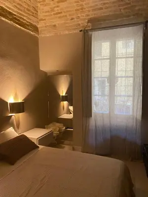 Letto o letti in una camera di Parma Centro House