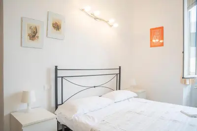 Letto o letti in una camera di 007 - Casa Marina fronte mare tra borgo e spiaggia
