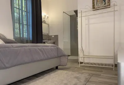 Letto o letti in una camera di Notte Rosa Suites & Relax