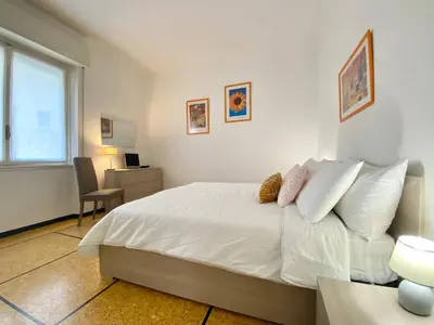 Letto o letti in una camera di CasaViva- Ampio e luminoso quadrilocale a Rapallo