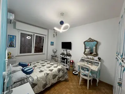 Letto o letti in una camera di Casa di Amos con parcheggio privato