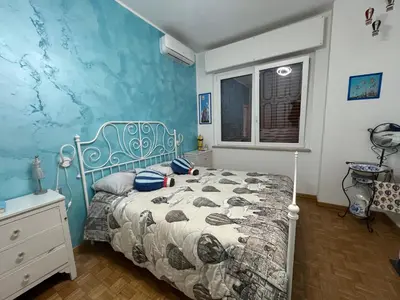 Letto o letti in una camera di Casa di Amos con parcheggio privato