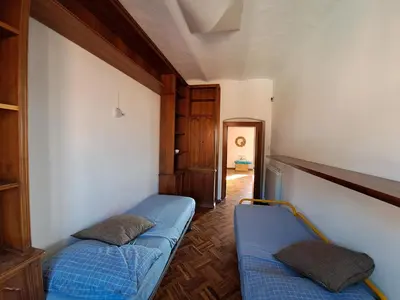 Letto o letti in una camera di Un camino in Riva al mare