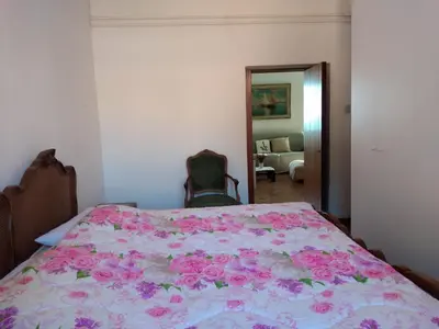 Letto o letti in una camera di Un camino in Riva al mare