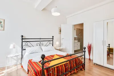 Letto o letti in una camera di AriediParma Appartamenti