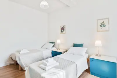 Letto o letti in una camera di AriediParma Appartamenti