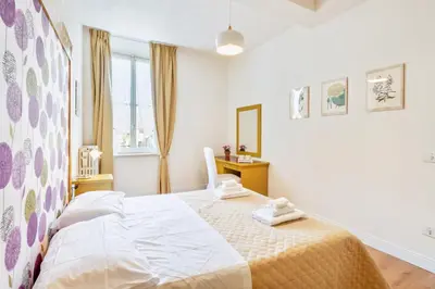 Letto o letti in una camera di AriediParma Appartamenti