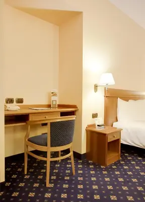 Letto o letti in una camera di Hotel Ovest