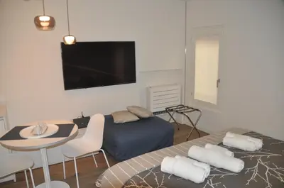 Letto o letti in una camera di Modena Charme Belle Arti