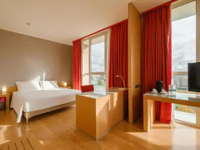 Letto o letti in una camera di B&B HOTEL Remilia
