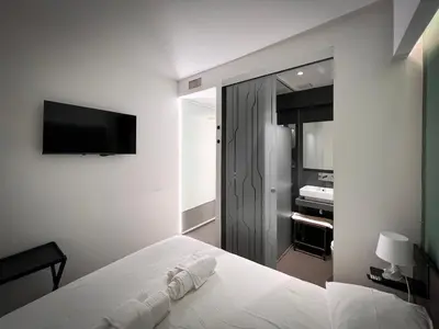 Letto o letti in una camera di Mutina Suites