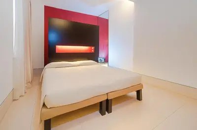 Letto o letti in una camera di Savoy Hotel
