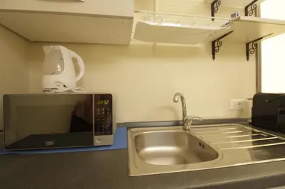 Cucina o angolo cottura di Elegante Suite con giardino in centro storico