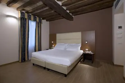 Letto o letti in una camera di Hotel Villa Ducale