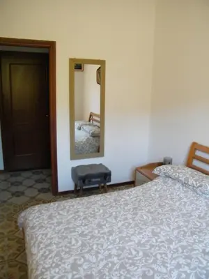 Letto o letti in una camera di DEIVA MARINA appartamento in Residence vicino a cinque terre