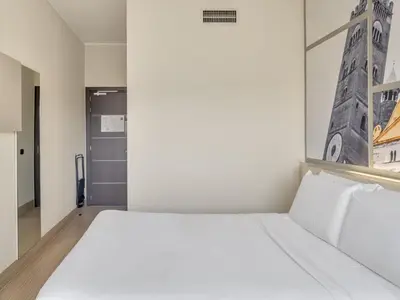 Letto o letti in una camera di B&B Hotel Cremona