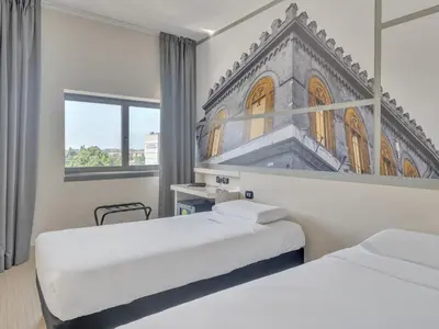 Letto o letti in una camera di B&B Hotel Cremona