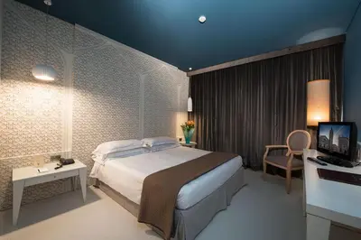 Letto o letti in una camera di Grand Hotel De La Ville