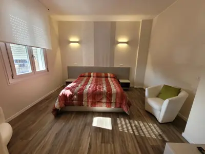 Letto o letti in una camera di STOP&GO Suites and Apartments