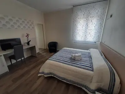 Letto o letti in una camera di STOP&GO Suites and Apartments