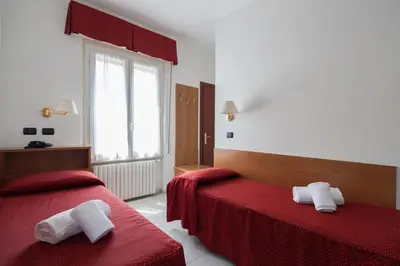 Letto o letti in una camera di Hotel Nella