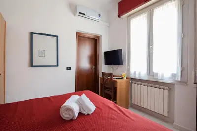 Letto o letti in una camera di Hotel Nella