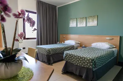 Letto o letti in una camera di Hotel Ayri