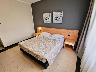 Letto o letti in una camera di Hotel Ayri