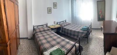 Letto o letti in una camera di Casa Bianca 4 - confortevole in centro a Moneglia