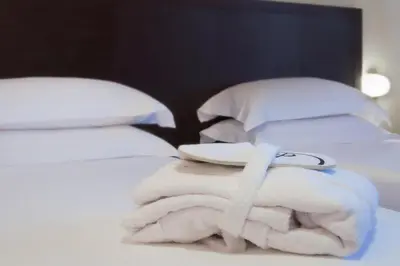 Letto o letti in una camera di CDH Hotel Modena