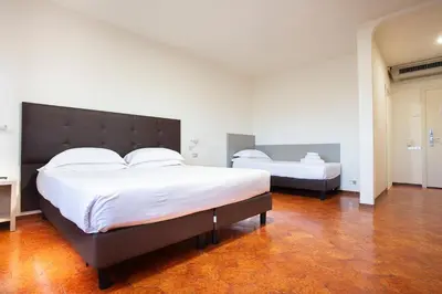 Letto o letti in una camera di CDH Hotel Modena