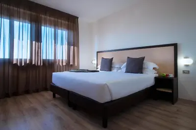 Letto o letti in una camera di CDH Hotel Modena