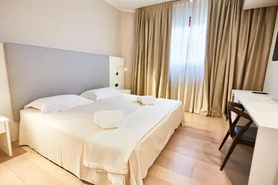 Letto o letti in una camera di Ferretti MajesticHouse