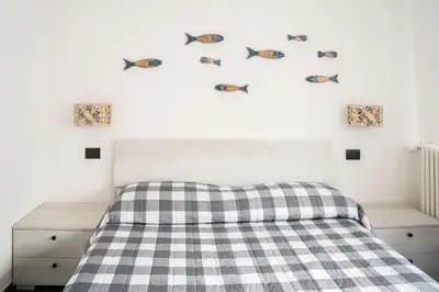 Letto o letti in una camera di 021 - Casa Ponente con Terrazzo - CENTRO città, Carruggio e Mare BAIA DEL SILENZIO a 500 m