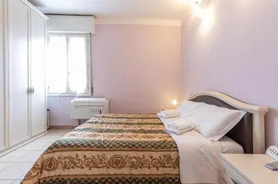 Letto o letti in una camera di Da Birba a Casinalbo Affitti Brevi Italia