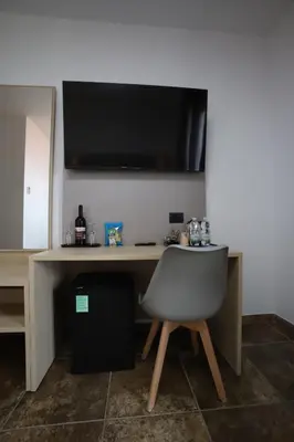 TV o dispositivi per l'intrattenimento presso Tiby Hotel